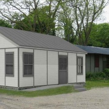 Baraque de type canadien implantée dans la cité de lhabitat provisoire de Soye