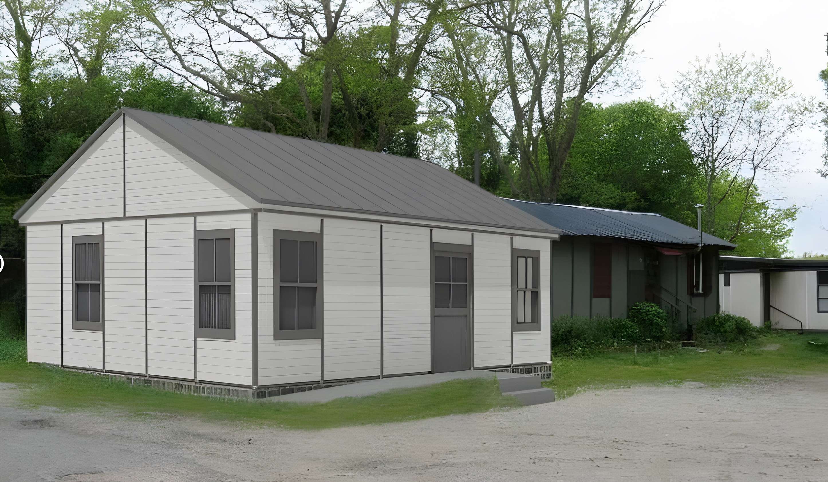 Baraque de type canadien implantée dans la cité de l'habitat provisoire de Soye